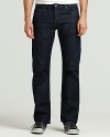 J Brand's five pocket slim straight leg jeans with zip fly and button closure. Dark wash denim with no fading or distressing. Slight whiskering in front. Signature stitch on back pockets.