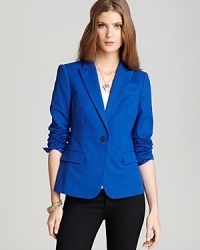 Bolt out the blue in a lightweight Aqua blazer and add cool color to your wardrobe. A polished look for day or night, this tailored piece flaunts must-have style this season.