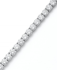 Match point. Arabella's stunning tennis bracelet combines dozens of round-cut Swarovski zirconias (31 ct. t.w.) in polished sterling silver. Approximate length: 7-1/2 inches.