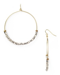 Work this season's exotic influences into your accessories collection with this pair of beaded hoop earrings from Vanessa Mooney, accented by an eclectic mix of silver nuggets.