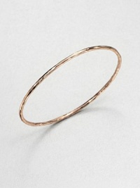 From the Smooth Rose Collection. A wavy oval bangle with a sculptural look is crafted of sterling silver and 18k gold finished with the warm glow of 18k rose goldplating.18k gold and sterling silver with 18k rose goldplatingDiameter, about 2Slip-on styleImported