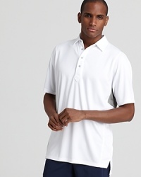 A classic fit polo with a contrast racerback panel makes a statement on and off the course.