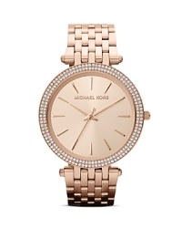 Everything's coming up rose gold! Work this on-trend hue into your wardrobe with accessories--like this Michael Kors watch. You'll love the bracelet strap and the stone detail around the dial.