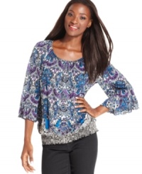 Style&co.'s peasant top is perfected with a vibrant print and pretty sleeves with ruffled cuffs.