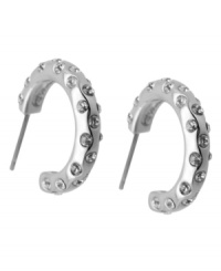 Crystal clear fashion. T Tahari blends silver tones with shimmering crystal studs on these hoop earrings. Crafted in silver tone mixed metal. Base metal is nickel-free for sensitive skin. Approximate diameter: 1 inch.