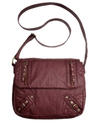 Add a little attitude to your everyday accessorizing with this urban-chic crossbody from Roxy. Antiqued brass stud and zipper accents give the outside some edge, while the organized interior keeps your essentials safe.