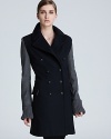 A finely tailored Jean Paul Gaultier coat masters on-trend color blocking while still maintaining its downtown edge.