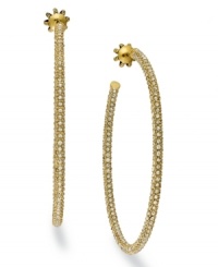 Hoop dreams. Juicy Couture offers these gold tone earrings, crafted from brass, and adorned with glass accents for a touch of glamour. Approximate diameter: 2-1/2 inches.