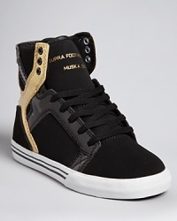 Supra's cutting-edge sneaker style is rendered in a cool combination of soft nubuk and reflective patent leather.