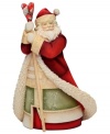 Spread the love this holiday season. This figurine stands tall on any table or mantle as Santa Claus, in traditional robe and hat, holds a heart-shaped staff. With crystal accents.