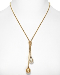 A delicate gold necklace with Lariat knot and double man-made pearl pendant. Designed by Majorica.