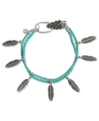 Turn over a stylish new leaf. This charm bracelet from Lucky Brand is crafted from silver-tone mixed metal with turquoise beads and leaf accents adding a whimsical pop. Approximate length: 7-5/8 inches.