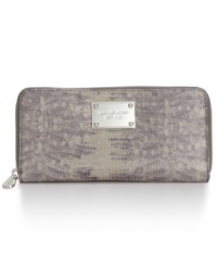 Stay organized in the most exotic way with this leather lovely from MICHAEL Michael Kors. Posh, python-print and signature plaque adorn the outside, while the pocket-lined interior keeps your currency in check.