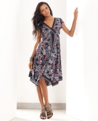 A vibrant paisley print and handkerchief hem lend an exotic look to INC's easy petite dress. (Clearance)