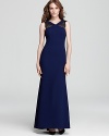 A high neck lends a modern feel to BCBGMAXAZRIA's v neck Evan gown, detailed in sheer lace for an alluring look.