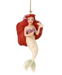 An underseas treasure for your tree, this Ariel ornament evokes the classic Disney film. The little mermaid dreams she's back on land, just in time for Christmas! (Clearance)