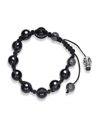 Spiritual-inspired bracelets are all the rage this season! Snap up this hot style from Ali Khan featuring semi-precious black agate beads and a silver tone skull accent on a trendy black cord. Bracelet adjusts to fit the wrist. Approximate diameter: 2 inches. Approximate length: 12-1/4 inches.