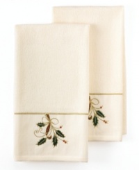 Add some Christmas spirit to your holiday cooking with cheery kitchen linens from Lenox. A pair of towels embroidered with a festive holly motif gets home cooks in the mood to roast, simmer and bake. With swirling gold and plaid ribbon, plus a cheery red border.