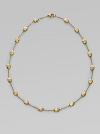 From the Siviglia Collection. Textured oval beads of 18k gold, delicately attached by gold chains. 18k yellow gold Length, about 16 Lobster clasp Made in Italy