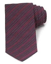 A traditionally striped tie in pure Italian silk lends luxury to your polished wardrobe and can be worn to work or your dressed-up evening affairs.