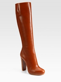 Richly hued leather in a knee-high silhouette with a side zipper, sky-high heel and signature red leather sole. Stacked heel, 4 (100mm)Covered platform, ½ (15mm)Compares to a 3½ heel (90mm)Shaft, 15½Leg circumference, 14Leather upperSide zipperLeather liningSignature red leather solePadded insoleMade in ItalyOUR FIT MODEL RECOMMENDS ordering one size up as this style runs small. 