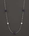 This sterling silver necklace, gleaming with amethysts and freshwater pearls, makes an elegant statement. By Di MODOLO.