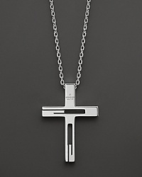 Sterling silver forms an elegant cross pendant.