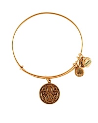 Simply styled in plated gold, this Alex and Ani bangle is a meaningful addition to your bracelet stack with its etched Path of Life charm.