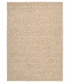 A blizzard of soft spots linger in between imperfect lines, creating beautiful harmony against a gentle sand-hued ground. Hand tufted from 100% natural wool, this plush Calvin Klein rug is crafted using the cut-and-loop pile technique that creates a unique matte surface texture.