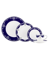 A show-stopping place setting from Marchesa by Lenox, this Empire Indigo dinnerware wows everyone around the formal table with bedazzling platinum patterns in fine bone china. A gracefully shaped cup, plates and more lend chic style to entertaining.