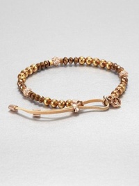 From the Brilliance Collection. A mix of beads in warm shades of rose gold and bronze includes faceted glass, smooth rose gold-finished stainless steel and rhinestone-crusted spheres, strung on a stretchy strand with a leather slide close.GlassRose goldtone and stainless steelLeatherDiameter, about 2.25Imported