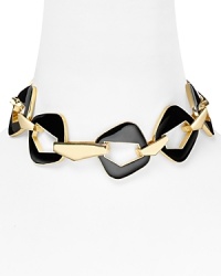 Belle Noel mines '60's inspiration for this large-link plated metal necklace. Crafted of gold tone and enamel it's bold lines evoke all that's slick and cool about pop art style.