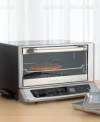 Cooking shouldn't be a guessing game - this smart toaster oven uses its Exact Heat™ sensor to maintain precise oven temperature. Bake, broil and toast in brilliant stainless steel with a brushed chrome commercial-style handle. Three-year limited warranty. Model TOB-155.