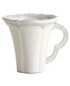 Handcrafted in the Italian tradition, the Merletto mug is intricately embellished with a lacy floral texture and painted a creamy antique white. An elegant companion to Arte Italica dinnerware.