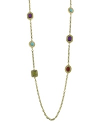 Neatly bejeweled. Colorful acrylic stones delicately dot the long gold tone chain on this 2028 necklace. Approximate length: 36 inches.