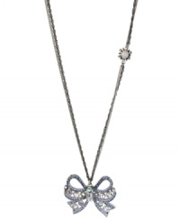 Take a bow. Betsey Johnson's silver tone mixed metal necklace features a sparkling bow pendant accented with clear and blue crystals, while a glass opal gem with crystal accents adorns the double silver tone chain. Approximate length: 32 inches + 3-inch extender. Approximate drop length: 1-3/4 inches. Approximate drop width: 2 inches.