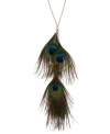 Strut your stuff in this peacock-inspired necklace from Betsey Johnson. A long gold tone chain dangles green faux-feathers and blue-colored teardrop accents. Crafted in antiqued gold tone mixed metal. Approximate length: 27 inches + 3-inch extender. Approximate drop: 12 inches.