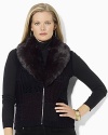 A superbly soft faux-beaver trim glamorously accents a chic knit vest with a timeless patchwork pattern.