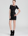 With a deep v back and daring cutouts, Rebecca Minkoff's crystal tweed dress puts a twist on traditional sheaths.