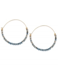 Tiny beads make a big statement on this pair of hoop earrings from Kenneth Cole New York. The silver and blue cherry beads adorn the earrings crafted from gold-tone mixed metal for a stunning look. Approximate drop: 2-1/4 inches.