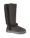 Stay warm in fine form in these UGG® Australia Boots that show off their shearling insides at the seams.