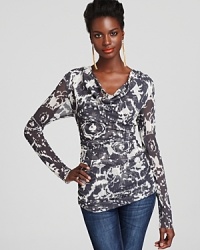 Casual elegance is yours with this printed Sweet Pea top, enriched with a draped cowl neckline and flattering ruched details.