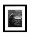 Play up your decor with this vinyl record-turned coaster photo print. In black and white for a sense of understated cool, it's classic for the home bar, living room or kitchen. With a black wooden frame from Lauren Ralph Lauren.