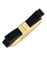 Keep it  black tie with a little help from Vince Camuto. A golden setting flaunts a black leather strip in a bow tie design. Crafted in gold tone mixed metal. Approximate diameter: 2 inches.