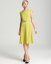 A swing skirt lends a ladylike look to this belted, figure-flattering Anne Klein dress.