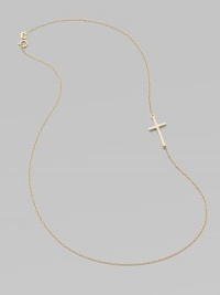 A wispy chain of 14k yellow gold features a cross pendant set askew for a modern edge.14k yellow gold Length, about 16 Pendant length, about ¾ Spring ring clasp Made in USA