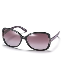 Look elegant in Tory Burch's oversized butterfly frame sunglasses with signature logo detail at temples.