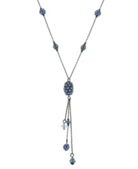 Chase away the blues by layering on this sparkling Y necklace featuring faceted and round-cut sapphire-colored crystals by 2028. Crafted in mixed metal. Approximate length: 16 inches + 3-inch extender. Approximate drop: 3 inches.