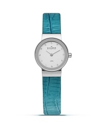 Add a sleek shot of color to your look with this watch from Skagen. Accented by a bold blue leather band, it boasts an understated silhouette and advanced Japanese quartz movement for the perfect fusion of form and function.