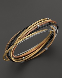 18K gold stations accent a mix of stainless steel cable bangles in black, grey, rose and yellow PVD. From Charriol.